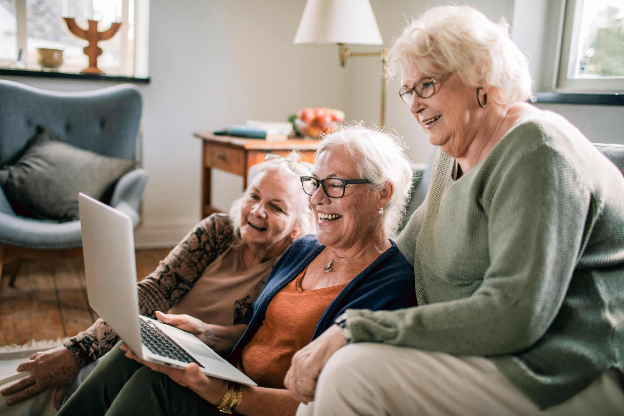 canva-senior-women-laptop-meeting