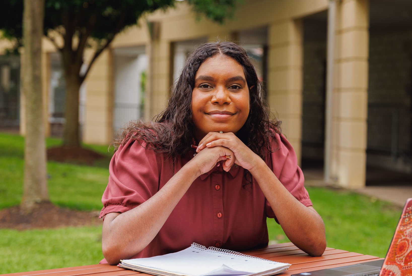 Portrait Of Female Aboriginal Australian Student On University Campus