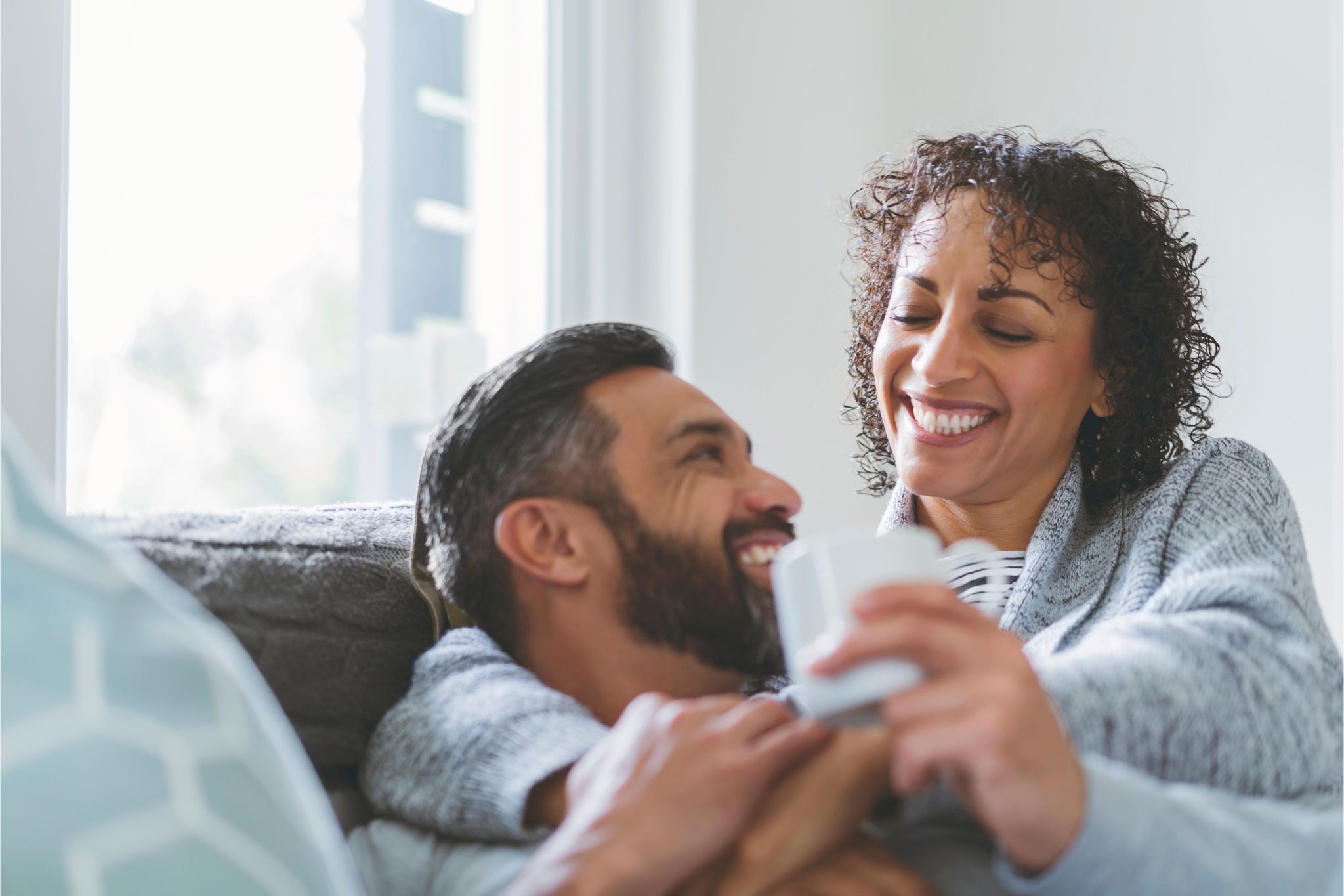 canva-smiling-couple-resting-home
